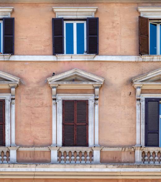 Facade details of beautiful old buildings in the center of Rome, Italy